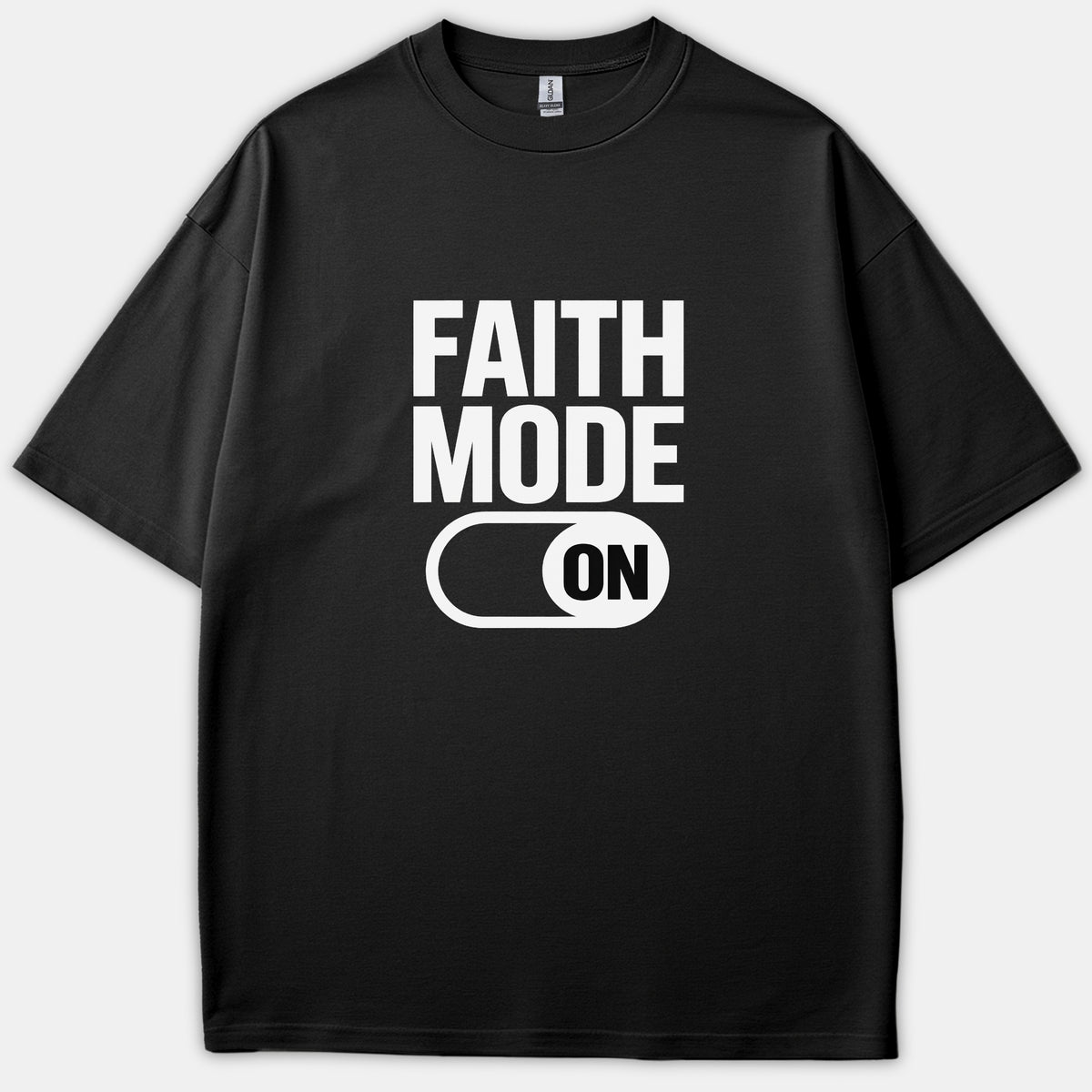 A black t-shirt featuring a white graphic print that reads 'FAITH MODE' above a toggle switch set to 'ON'.