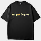 A black t-shirt featuring the phrase 'I'm good forgiven' with the word 'good' struck through with a yellow line across the chest.
