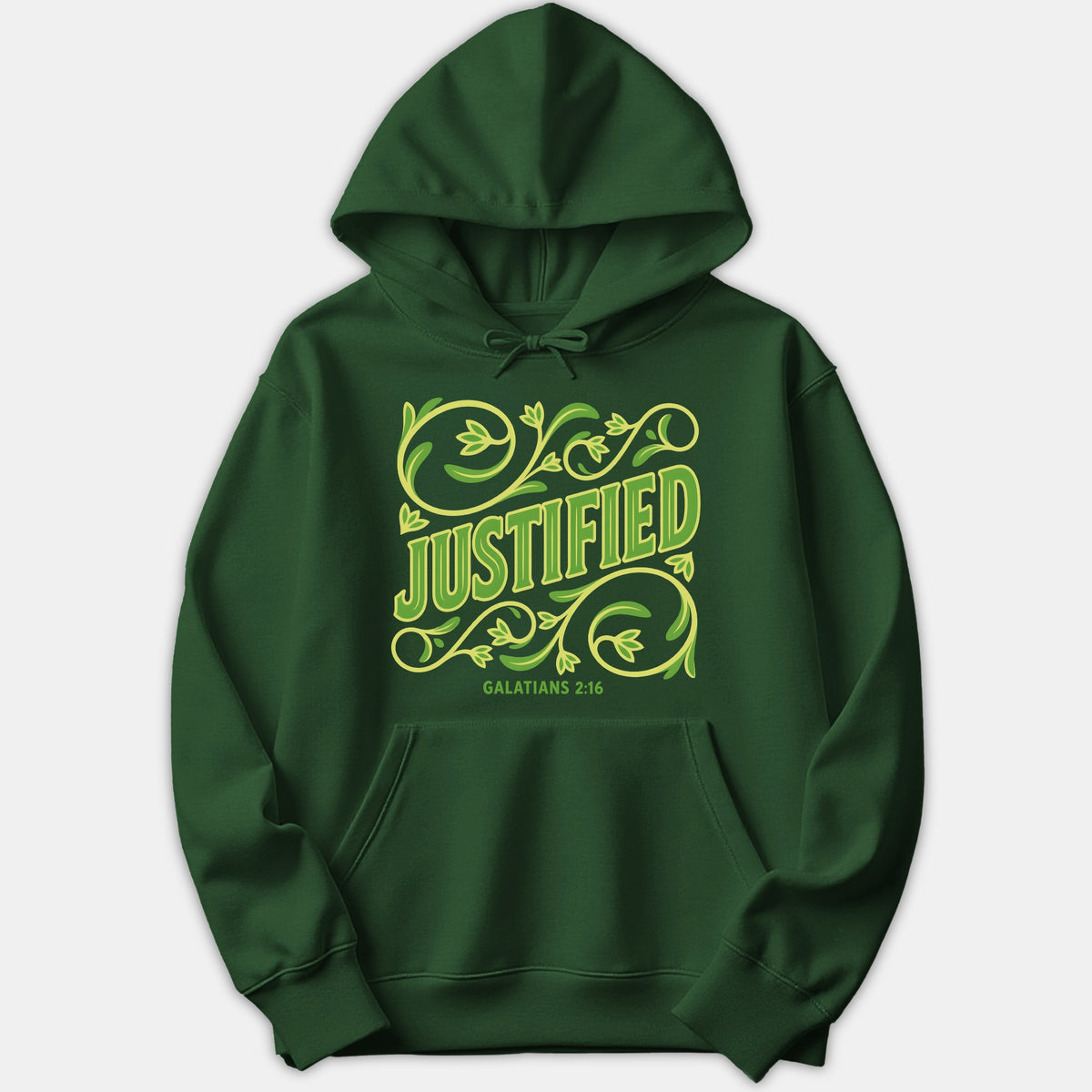 A dark green hoodie featuring the word JUSTIFIED surrounded by ornate vine illustrations and the scripture reference Galatians 2:16 printed on the front.
