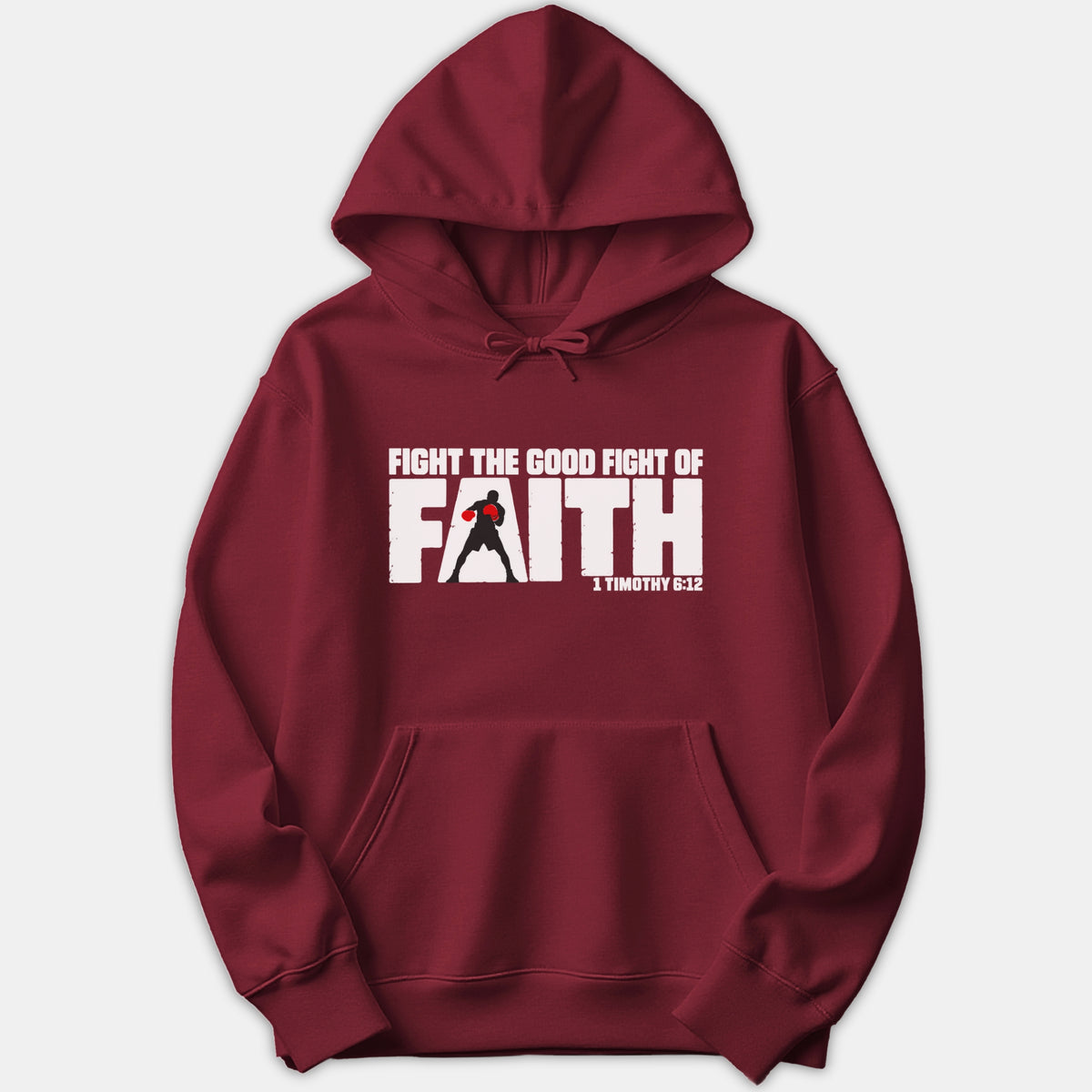 A maroon hoodie featuring a bold graphic reading 'Fight the Good Fight of Faith' with a silhouette of a boxer in red gloves and scripture reference 1 Timothy 6:12.