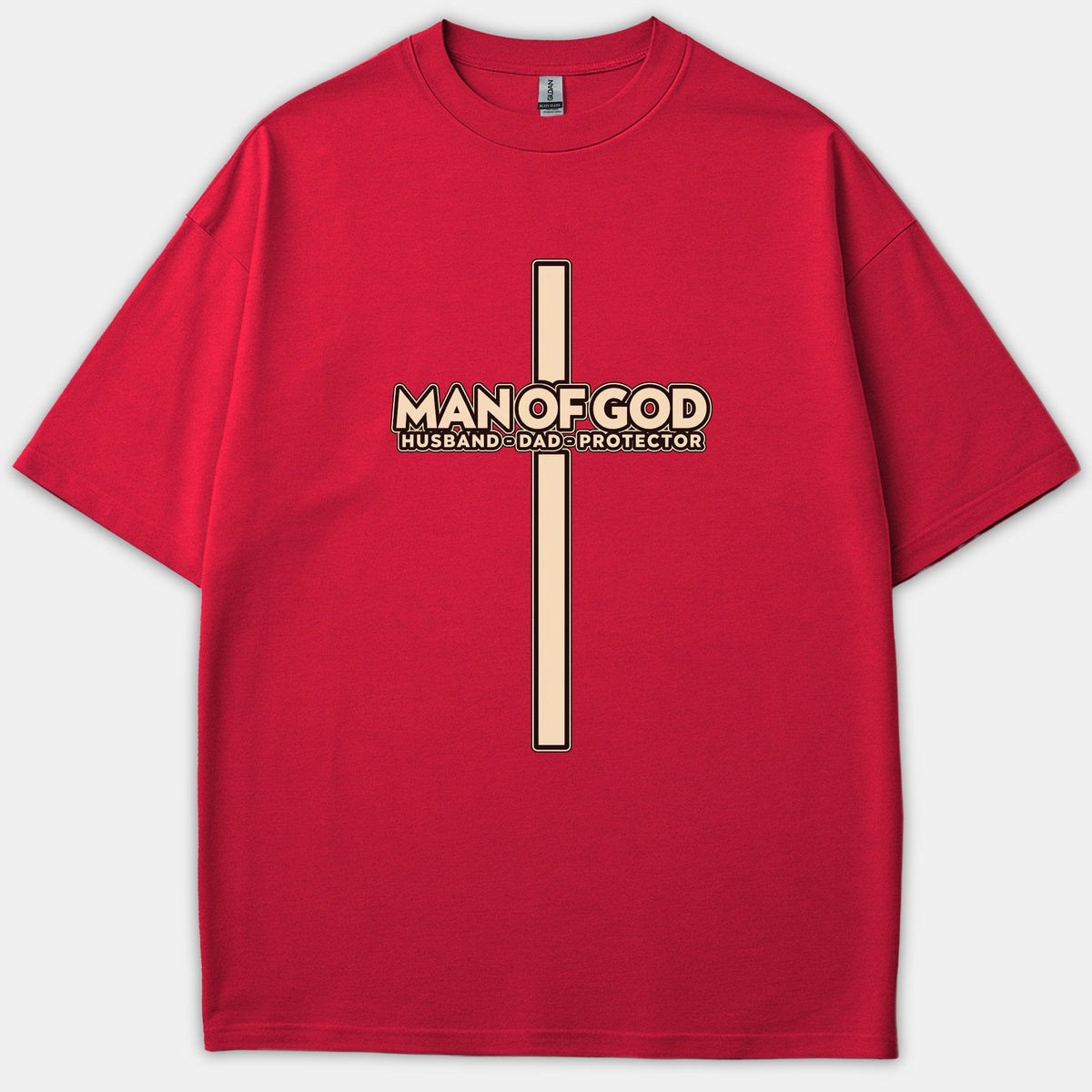 A red Christian t-shirt featuring a long vertical cross graphic overlaid with the phrase 'MAN OF GOD HUSBAND DAD PROTECTOR'.