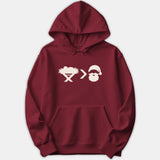 A red Christmas hoodie featuring a white graphic print of a manger symbol, a greater-than sign, and Santa Claus.