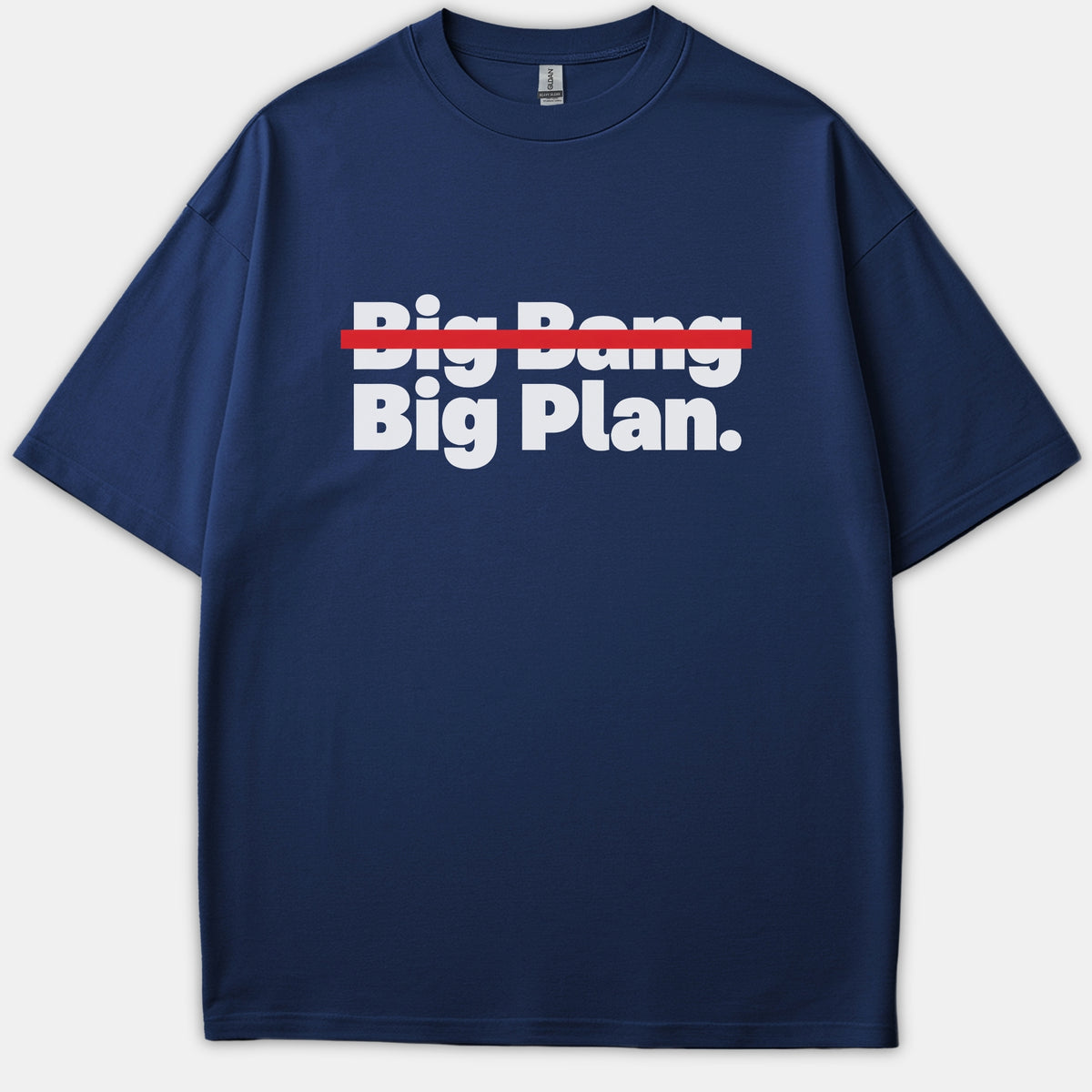 A navy blue Christian t-shirt featuring bold white text reading 'Big Bang' crossed out with a red line above the phrase 'Big Plan.'
