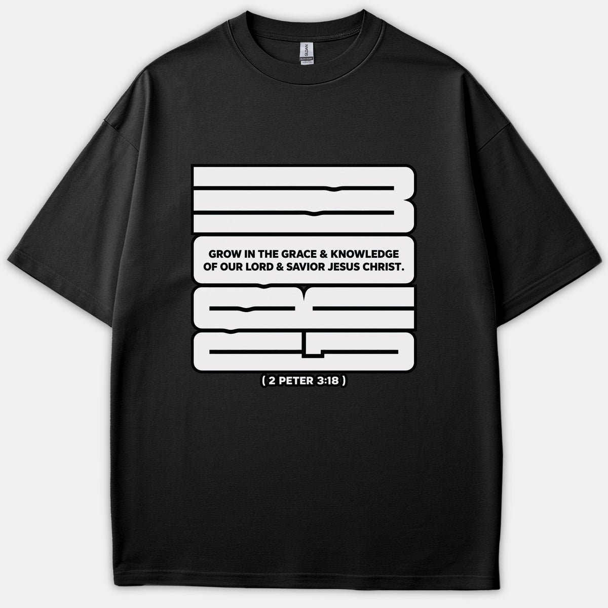A black T-shirt featuring a bold white graphic design with the scripture quote Grow in the grace and knowledge of our Lord Jesus Christ from 2 Peter 3:18.