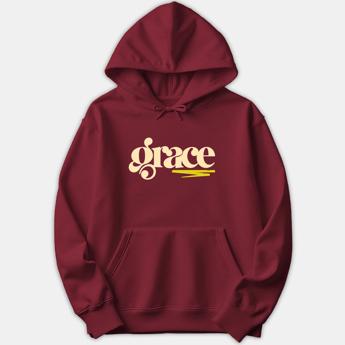 A maroon red hoodie featuring the word grace printed in a retro cream typography with a yellow brushstroke underline.