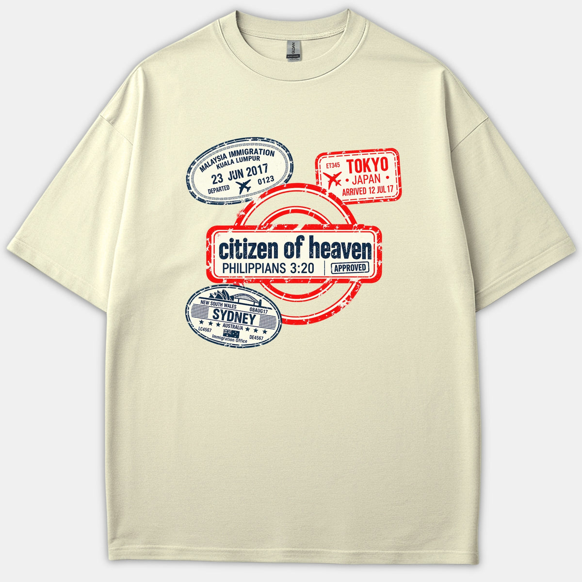 A beige Christian t-shirt featuring vintage travel passport stamps with a prominent central red stamp reading 'citizen of heaven PHILIPPIANS 3:20 APPROVED'.