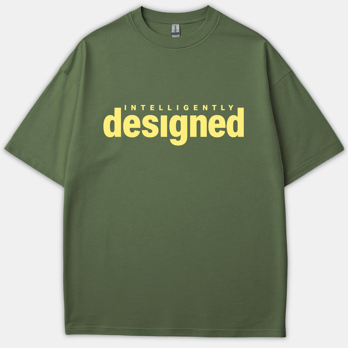 An olive green Christian T-shirt featuring the words 'INTELLIGENTLY designed' printed prominently across the chest in pale yellow lettering.