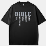 A black t-shirt featuring a distressed vintage graphic that spells out BIBLE alongside the acrostic Basic Instructions Before Leaving Earth.