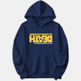 A navy blue hoodie featuring a bold yellow graphic that reads 'JESUS PUT DEATH TO DEATH' along with the scripture reference '1 CORINTHIANS 15:54-55'.