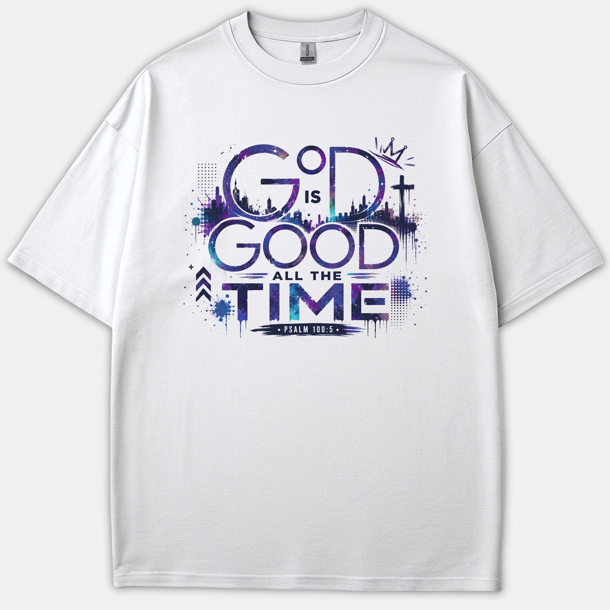 A white Christian t-shirt featuring a cosmic purple and blue galaxy graphic that reads God Is Good All The Time with Psalm 100:5.