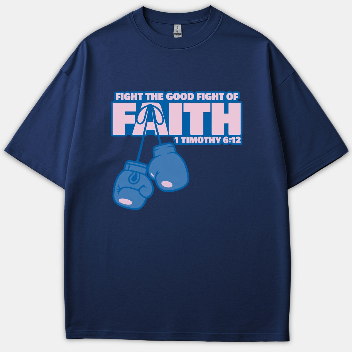 A navy blue t-shirt featuring hanging boxing gloves and graphic text reading Fight the Good Fight of Faith with the scripture reference 1 Timothy 6:12.
