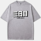 A heather gray t-shirt featuring bold 3D Japanese characters with the text 3RD DAY printed in black below.
