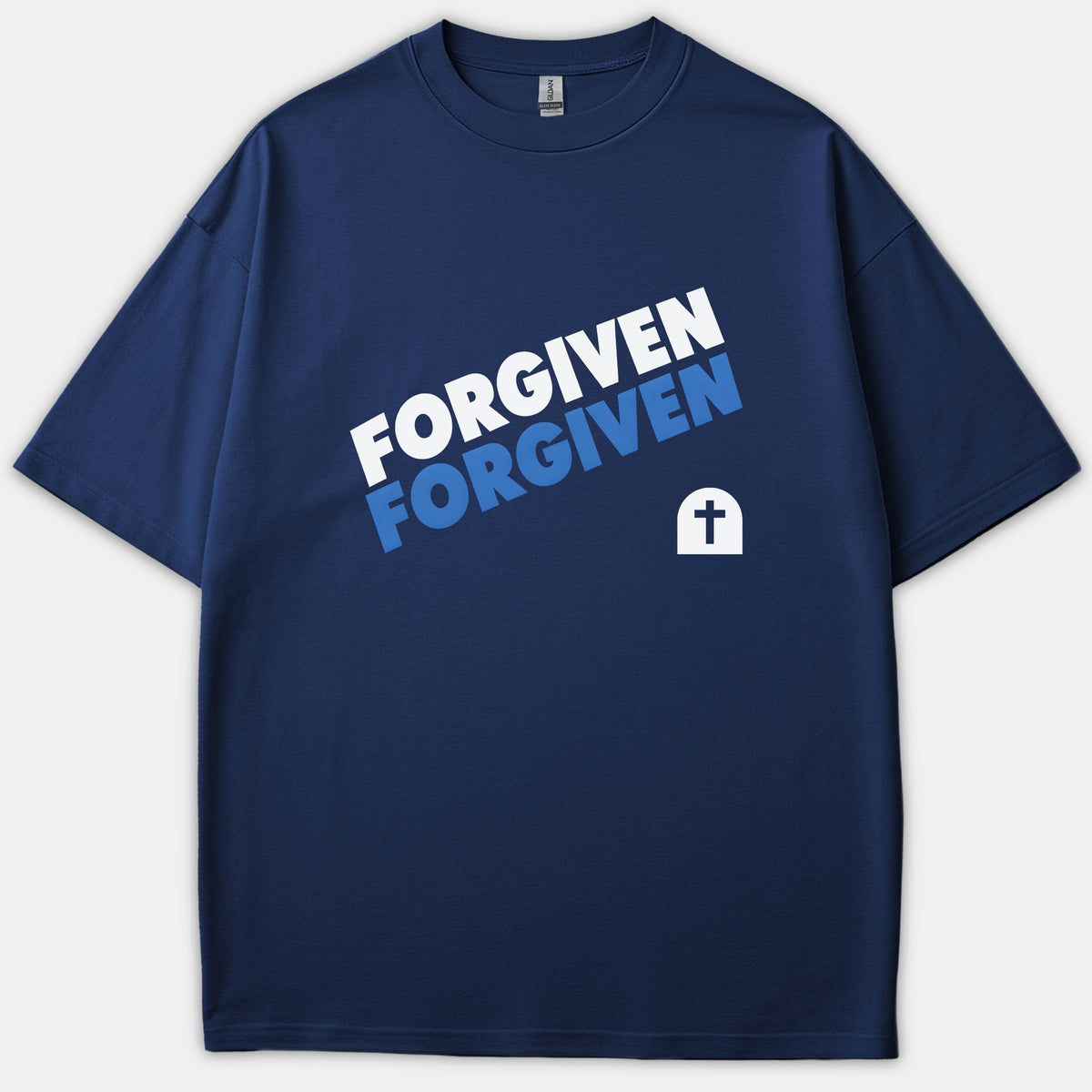 A navy blue Christian t-shirt featuring the word FORGIVEN printed in bold white and blue text alongside a tomb icon with a cross.