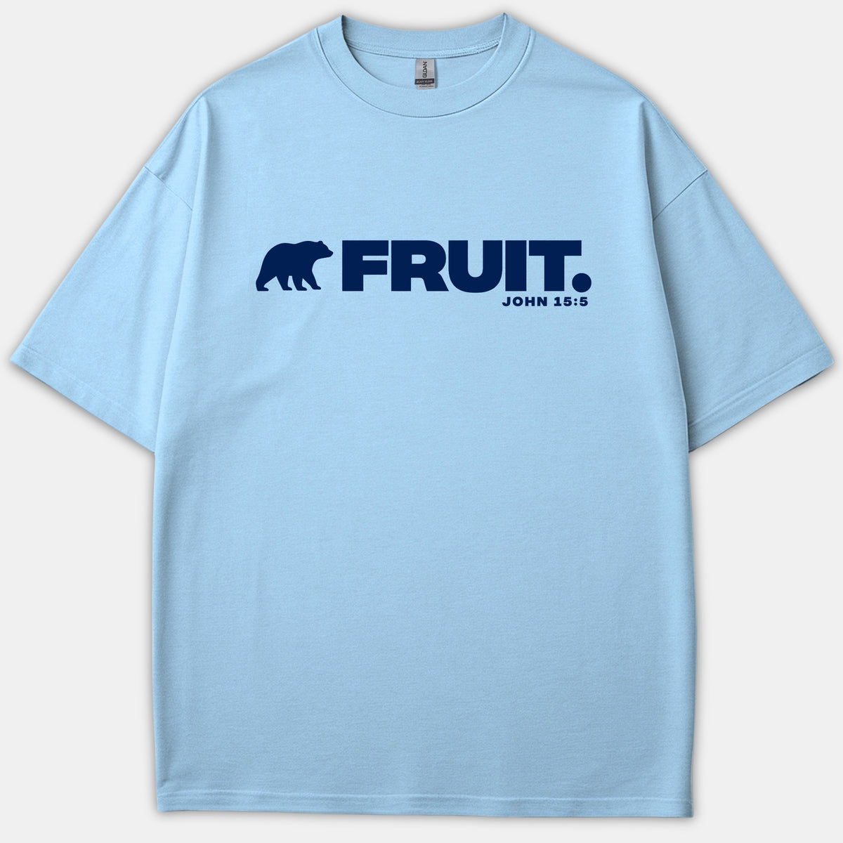A light blue t-shirt featuring a navy bear silhouette beside the word FRUIT and scripture reference John 15:5 printed across the chest.