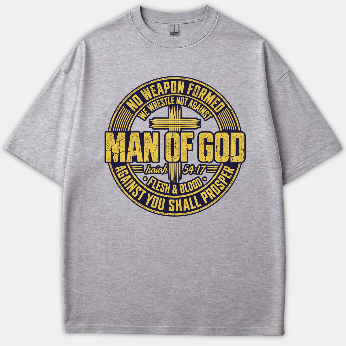 A gray Christian T-shirt featuring a circular distressed graphic with a cross, reading 'Man of God' and referencing Isaiah 54:17.