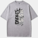 A gray Christian t-shirt featuring a graffiti-style graphic reading Jesus Is King with crown artwork and scripture from Revelation 17:14.