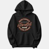 A black pullover hoodie with a circular graphic displaying 'Blessed Are The Merciful' and Matthew 5:7 scripture reference in orange and white typography.