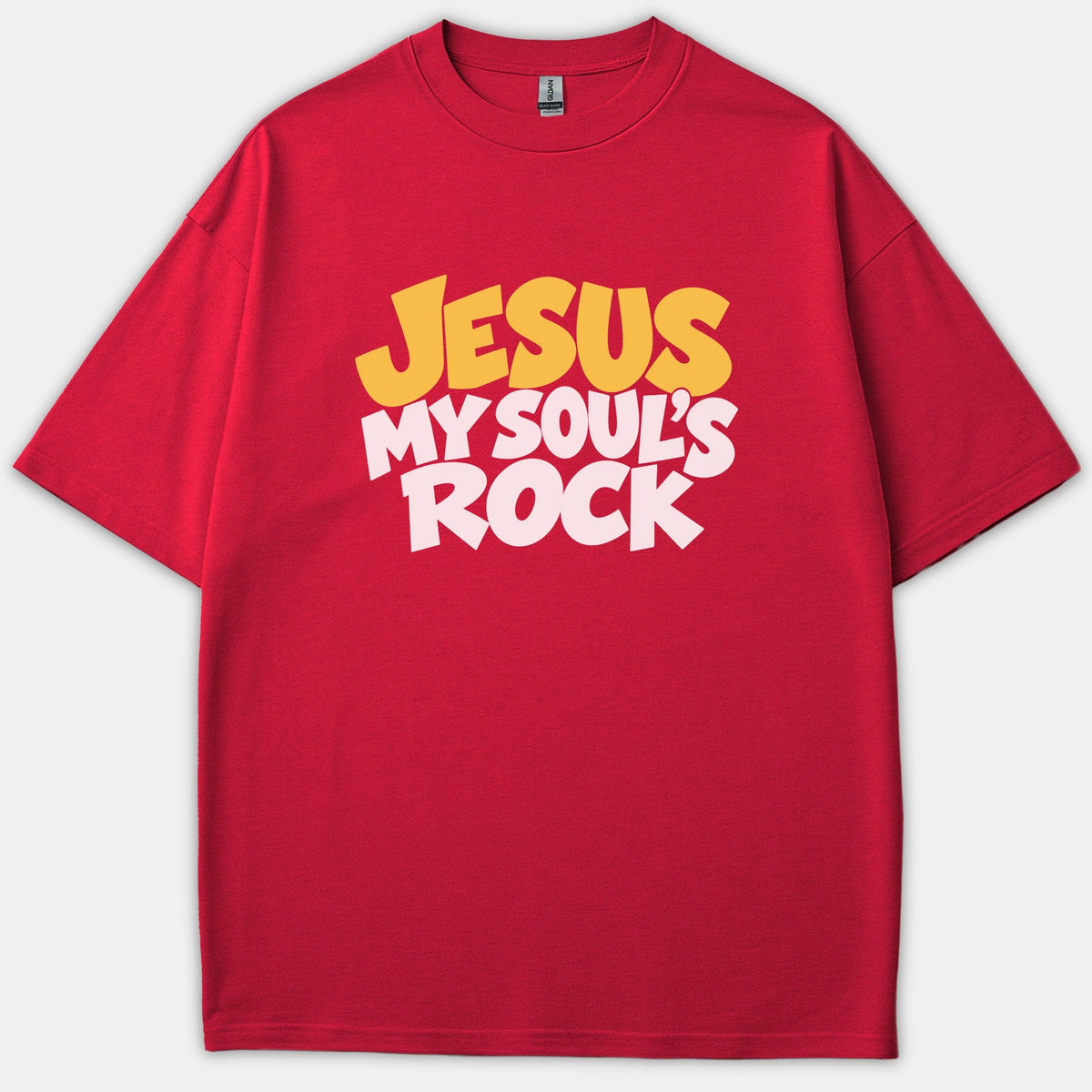 A red t-shirt featuring the phrase 'JESUS MY SOUL'S ROCK' printed across the front in bold yellow and white graphic typography.