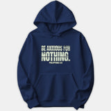 A navy blue pullover hoodie featuring a distressed white graphic print on the chest that reads BE ANXIOUS FOR NOTHING followed by the Bible reference PHILIPPIANS 4:6.