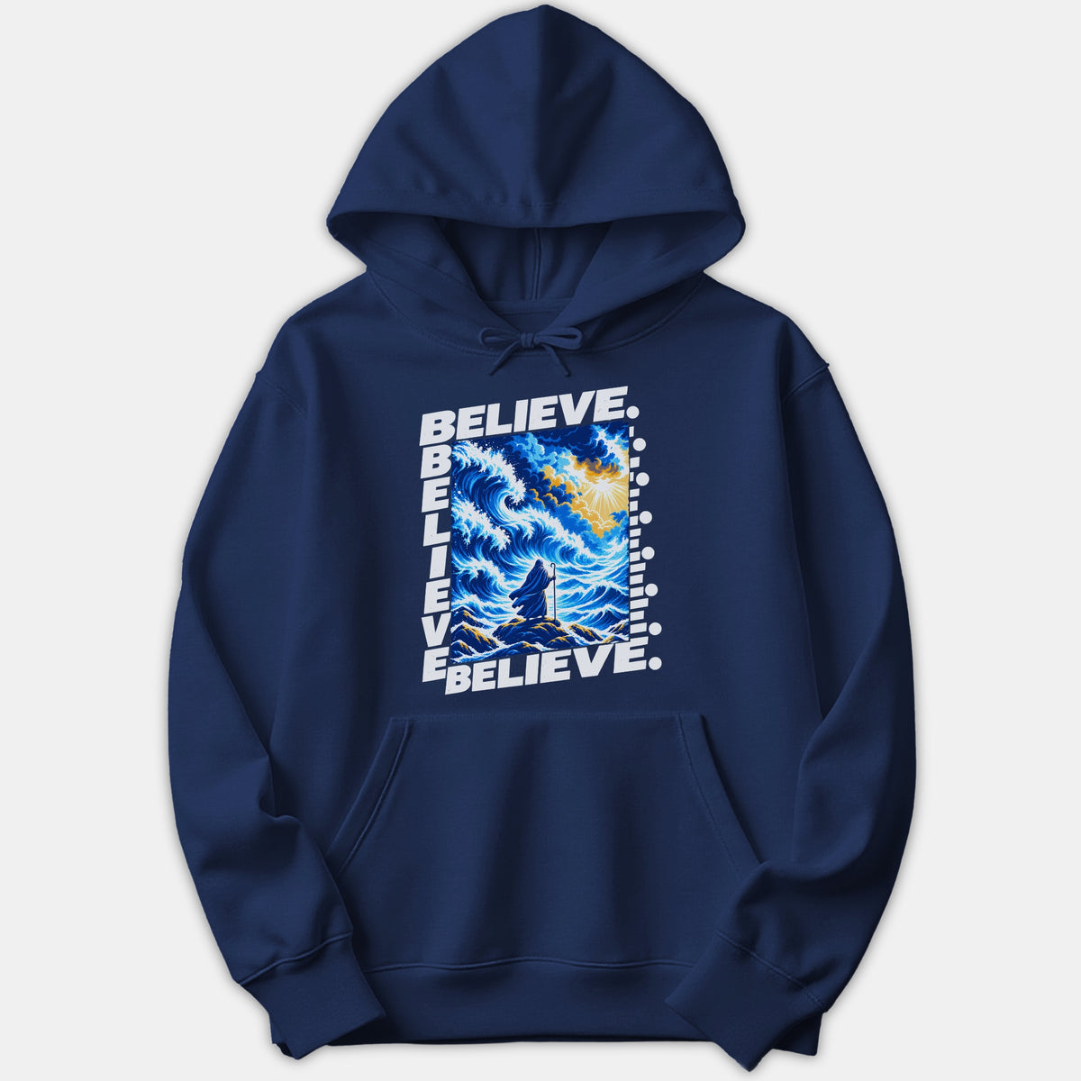 A navy blue hoodie featuring a graphic print framed with the word BELIEVE, depicting a robed figure standing before parting stormy sea waves under a bright yellow sky.