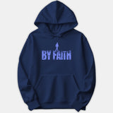 A navy blue hoodie featuring a light blue graphic that reads BY FAITH with a silhouetted figure walking across the top of the letters.