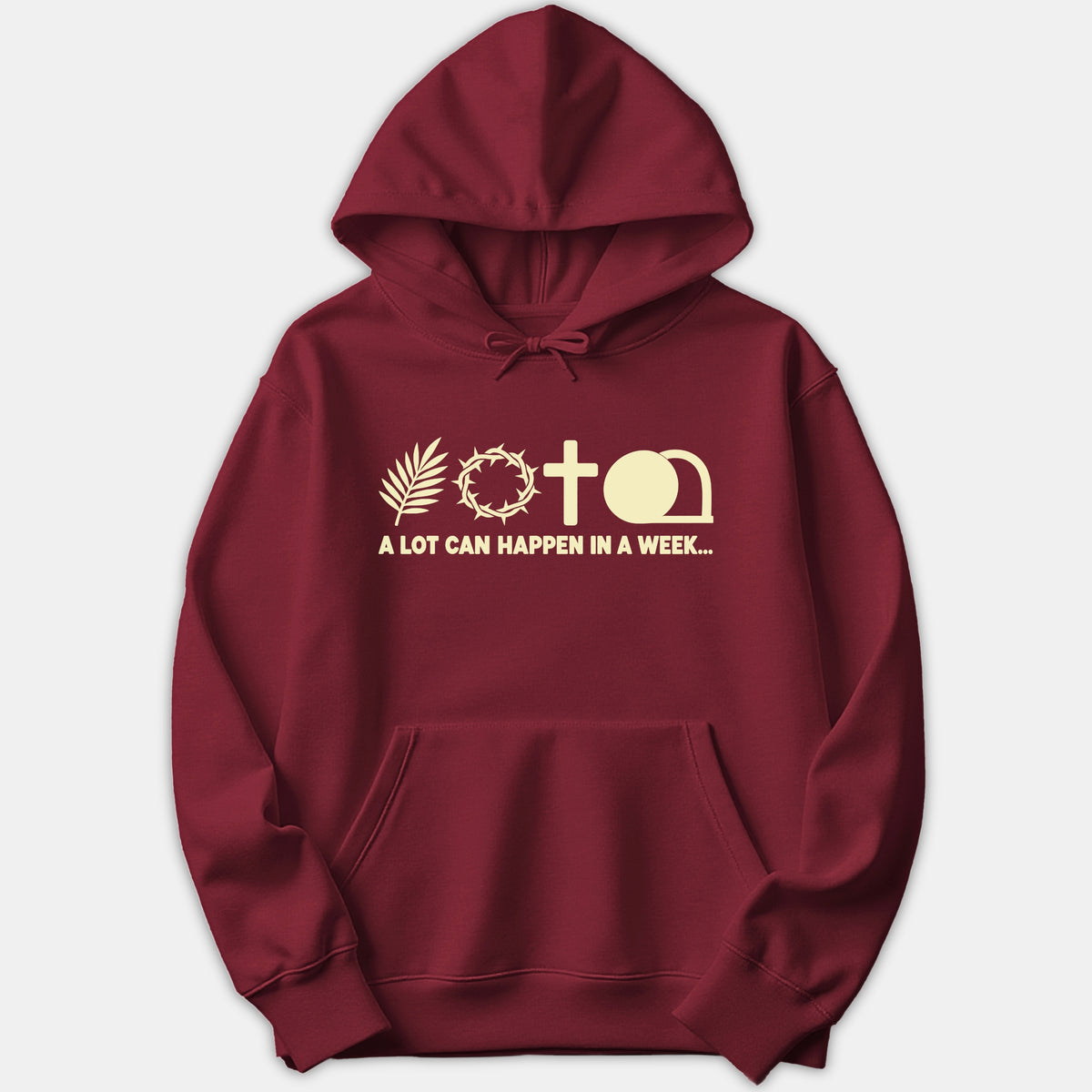 A red hoodie featuring Holy Week symbols including a palm branch, crown of thorns, cross, and empty tomb above the printed text A LOT CAN HAPPEN IN A WEEK.