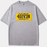 A gray t-shirt featuring a graphic designed like a yellow license plate with the text ALL MY SINS ARE 4GIV3N and COLOSSIANS 2:13.