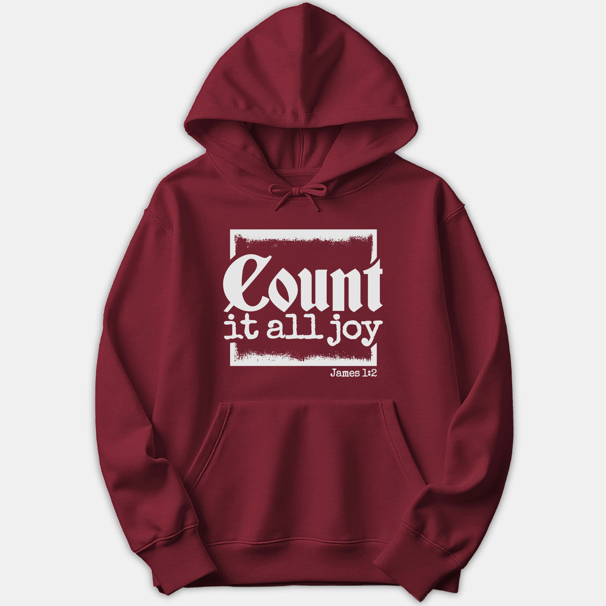 A red pullover hoodie featuring a white graphic print with the scripture phrase 'Count it all joy' and 'James 1:2' framed in a box.