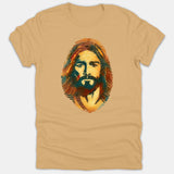 A beige T-shirt featuring a unique graphic of Jesus Christ stylized within a colorful fingerprint pattern using shades of orange, yellow, and blue.
