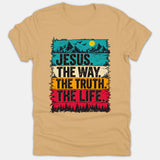 A beige Christian t-shirt featuring a retro mountain landscape graphic with colorful stripes and the text 'JESUS. THE WAY. THE TRUTH. THE LIFE.'