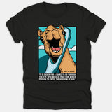 A black t-shirt featuring a cartoon camel squeezing through the eye of a needle, accompanied by a Bible verse about entering the Kingdom of God.