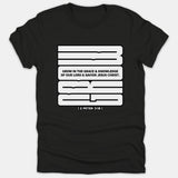 A black t-shirt featuring a bold graphic design with the scripture quote Grow in the Grace and Knowledge of Our Lord and Savior Jesus Christ from 2 Peter 3:18.