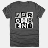 A dark gray t-shirt featuring a modern geometric graphic that spells out FORGIVEN alongside a Christian cross symbol in black, white, and gray tones.