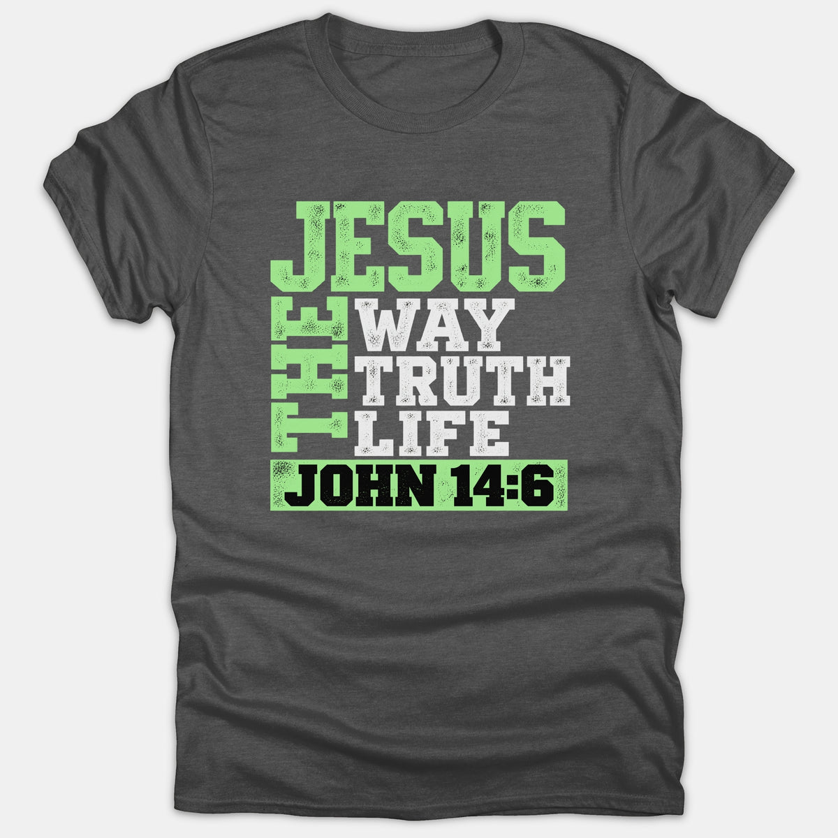 A dark gray t-shirt featuring a Christian graphic with the text Jesus The Way Truth Life displayed in bold green and white typography above a John 14:6 scripture reference.