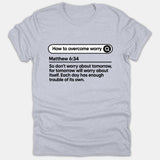 A light gray Christian t-shirt featuring a search bar design with the phrase 'How to overcome worry' and the scripture Matthew 6:34 printed in black.