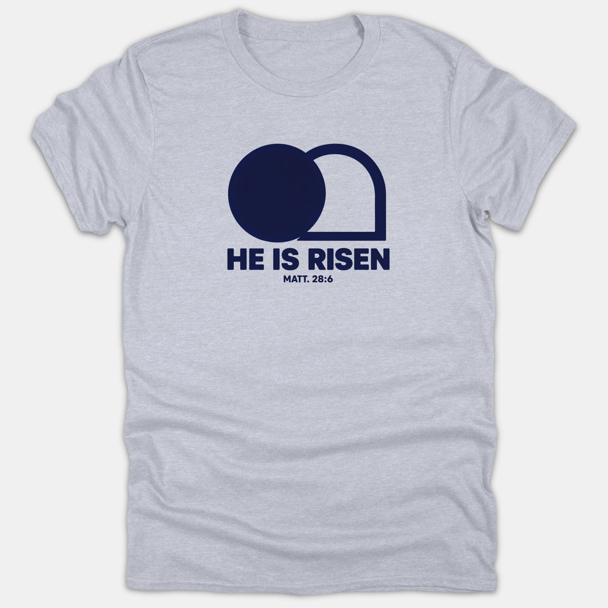 A gray Christian t-shirt featuring a navy graphic of an empty tomb above the words HE IS RISEN MATT. 28:6.