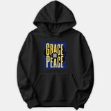 A black hoodie featuring a blue textured graphic on the front with bold yellow typography reading Grace and Peace.