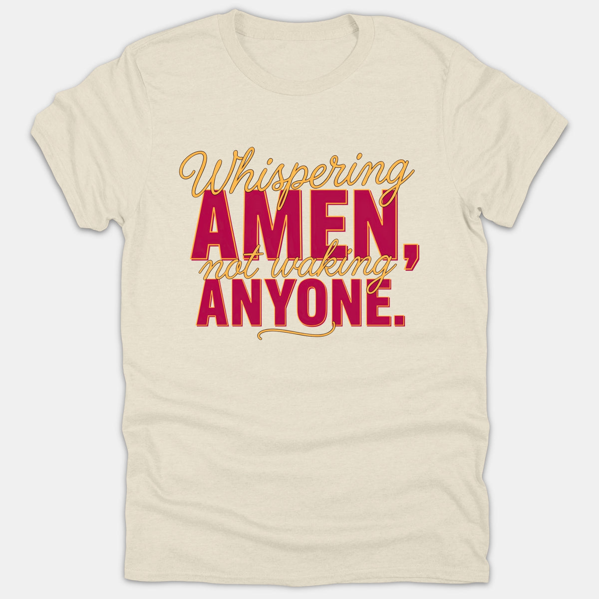 A beige Christian t-shirt featuring the text 'Whispering AMEN, not waking ANYONE.' printed in red and gold script and block lettering.