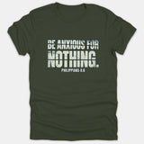 A dark green Christian t-shirt featuring a distressed graphic that reads 'BE ANXIOUS FOR NOTHING' with the Bible verse reference 'PHILIPPIANS 4:6' printed in off-white text.