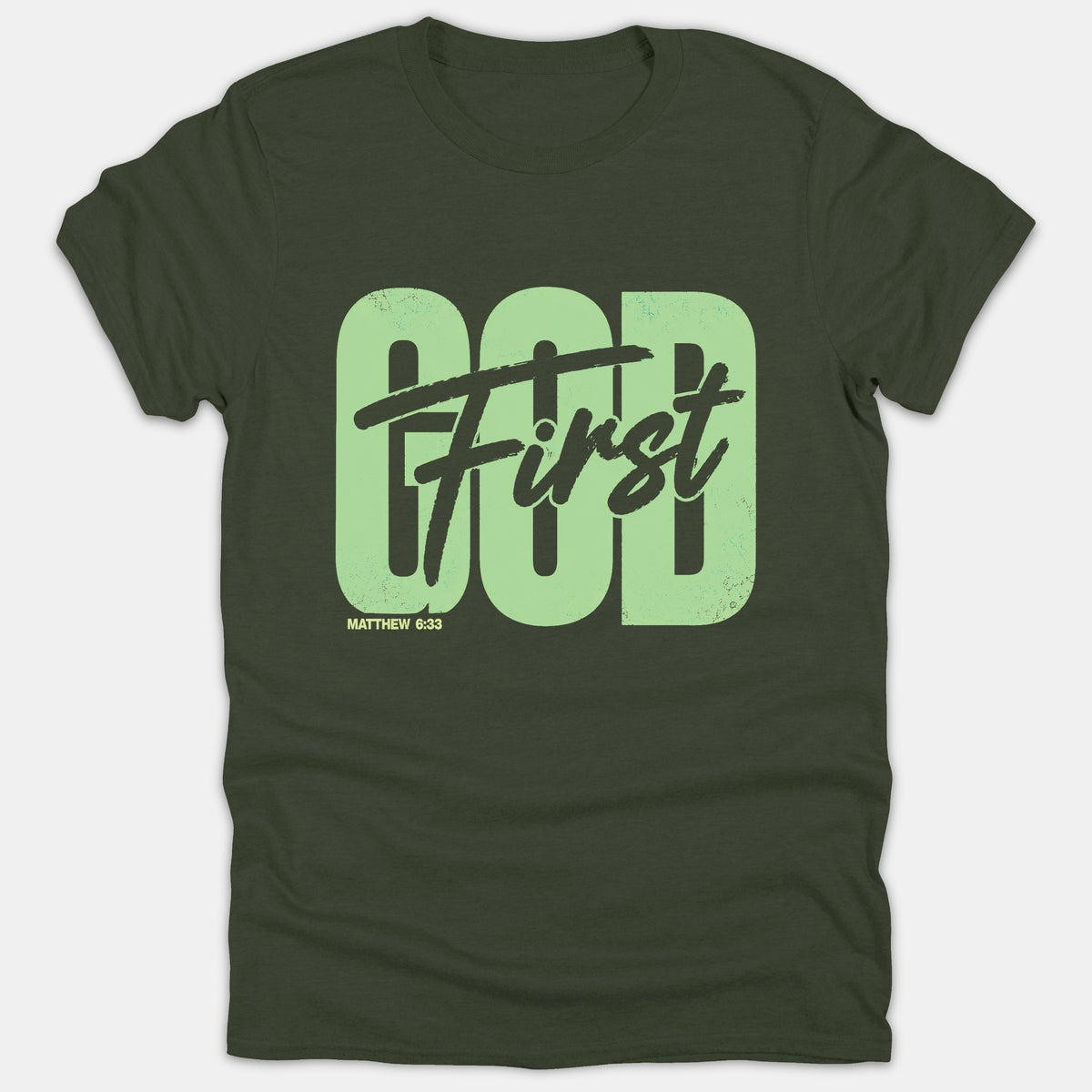 A dark green Christian t-shirt featuring 'GOD' in bold light green block letters overlaid with 'First' in black script and 'MATTHEW 6:33' below.