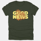A dark green T-shirt featuring bold yellow text reading GOOD NEWS with a dynamic brown liquid splash design across the center.